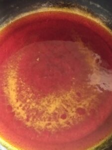 picture of oil in a pot for traditional red oil pepper sauce