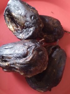 add your washed dry fish to the traditional red oil pepper sauce