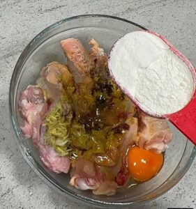 sprinkle in flour into the marinated chicken for sweet chicken combo recipe