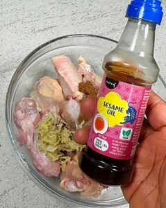 picture of sesame il added to chicken for sweet chicken combo recipe