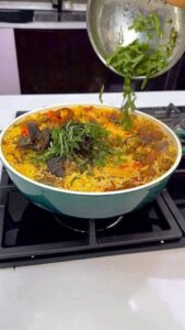 add scent leaf to your red oil rice