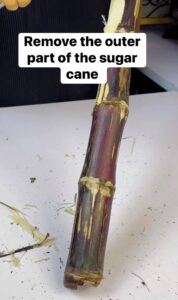remove the outer part of the sugar cane after washing