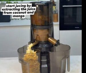 add coconut and mango into juicer or blender