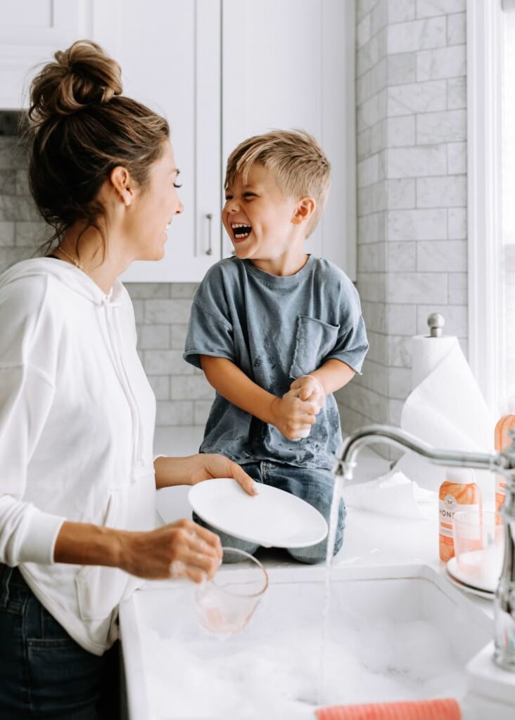 A MOM CLEANING WITH HER TODDLER