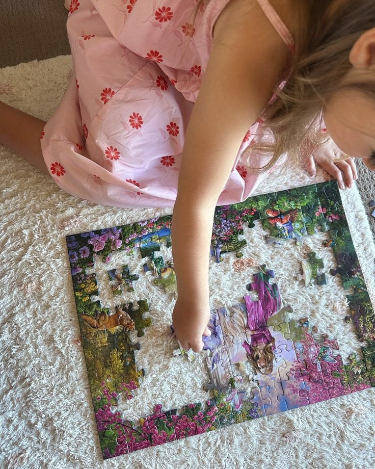 TODDLER LOOKING AT A PUZZLE