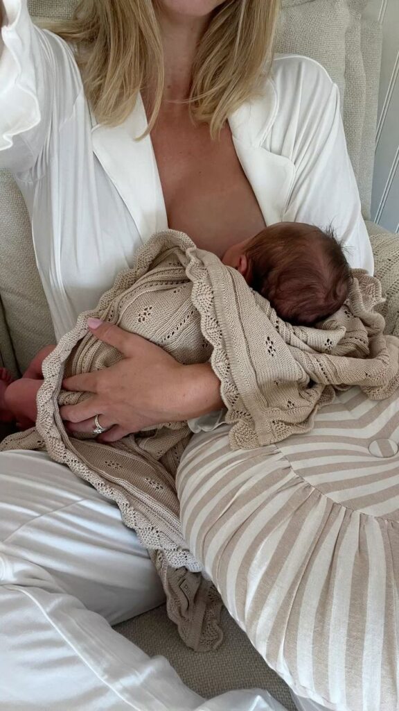 a mom breast feeding her baby